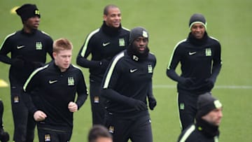 MANCHESTER, ENGLAND - APRIL 11: Kevin de Bruyne and Yaya Toure of Manchester City warm up with team mates during a training session ahead of the UEFA Champions League Quarter Final Second Leg match against Paris Saint-Germain at the Academy training ground on April 11, 2016 in Manchester, United Kingdom. (Photo by Gareth Copley/Getty Images)