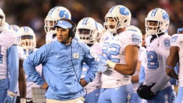 Oct 29, 2015; Pittsburgh, PA, USA; North Carolina Tar Heels head coach Larry Fedora (middle) looks on against the Pittsburgh Panthers during the second quarter at Heinz Field. Mandatory Credit: Charles LeClaire-USA TODAY Sports