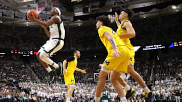 EAST LANSING, MICHIGAN - JANUARY 05: Cassius Winston #5 of the Michigan State Spartans drives the basket past Brandon Johns Jr. #23 of the Michigan Wolverines during the first half at Breslin Center on January 05, 2020 in East Lansing, Michigan. (Photo by Gregory Shamus/Getty Images)