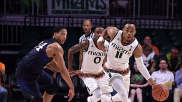 Nov 19, 2016; Coral Gables, FL, USA; Miami Hurricanes guard Bruce Brown (11) dribbles the ball past Pennsylvania Quakers guard Matt Howard (24) during the second half at Watsco Center. Miami won 74-62. Mandatory Credit: Steve Mitchell-USA TODAY Sports