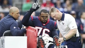 Jan 3, 2016; Houston, TX, USA; Houston Texans tackle Duane Brown (76) waves to the crowd after being carted off the field after an injury during the first quarter against the Jacksonville Jaguars at NRG Stadium. Mandatory Credit: Troy Taormina-USA TODAY Sports