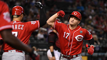 PHOENIX, ARIZONA - SEPTEMBER 15: Josh VanMeter #17 of the Cincinnati Reds celebrates with Eugenio Suarez #7 after hitting a solo home run off of Zac Gallen #59 of the Arizona Diamondbacks during the fourth inning at Chase Field on September 15, 2019 in Phoenix, Arizona. (Photo by Norm Hall/Getty Images)