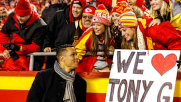 KANSAS CITY, MO - DECEMBER 13: Television broadcaster and former Kansas City Chiefs tight end Tony Gonzalez smiles at a sign held by Chiefs fans on the night Gonzalez was inducted into the team's Ring of Honor at Arrowhead Stadium on December 13, 2018 in Kansas City, Missouri. (Photo by David Eulitt/Getty Images)
