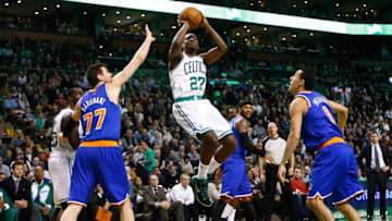 BOSTON, MA - DECEMBER 13: Jordan Crawford #27 of the Boston Celtics takes a shot in front of Andrea Bargnani #77 of the New York Knicks in the second quarter during the game at TD Garden on December 13, 2013 in Boston, Massachusetts. NOTE TO USER: User expressly acknowledges and agrees that, by downloading and or using this photograph, User is consenting to the terms and conditions of the Getty Images License Agreement. (Photo by Jared Wickerham/Getty Images)