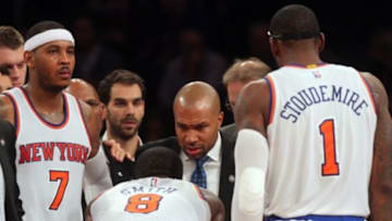 Nov 10, 2014; New York, NY, USA; New York Knicks head coach Derek Fisher coaches New York Knicks small forward Carmelo Anthony (7) and New York Knicks shooting guard J.R. Smith (8) and New York Knicks power forward Amar