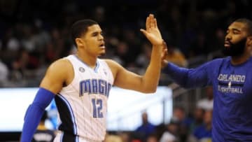 Apr 16, 2014; Orlando, FL, USA; Orlando Magic forward Tobias Harris (12) goes to high-five a teammate during a timeout in the first half against the Indiana Pacers at Amway Center. Mandatory Credit: David Manning-USA TODAY Sports