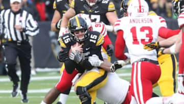 Nov 28, 2014; Iowa City, IA, USA; Iowa Hawkeyes quarterback Jake Rudock (15) is tackled by the Nebraska Cornhuskers at Kinnick Stadium. Mandatory Credit: Reese Strickland-USA TODAY Sports