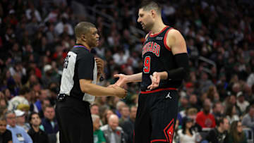 MILWAUKEE, WISCONSIN - APRIL 17: Nikola Vucevic #9 of the Chicago Bulls speaks with referee Tony Brothers #25 during the second half of Game One of the Eastern Conference First Round Playoffs against the Milwaukee Bucks at Fiserv Forum on April 17, 2022 in Milwaukee, Wisconsin. NOTE TO USER: User expressly acknowledges and agrees that, by downloading and or using this photograph, User is consenting to the terms and conditions of the Getty Images License Agreement. (Photo by Stacy Revere/Getty Images)