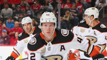 NEWARK, NJ - JANUARY 19: Josh Manson #42 of the Anaheim Ducks plays the puck against the New Jersey Devils during the game at Prudential Center on January 19, 2019 in Newark, New Jersey. (Photo by Andy Marlin/NHLI via Getty Images)
