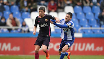 LA CORUNA, SPAIN - MARCH 12: Carles Gil of RC Deportivo La Coruna competes for the ball with Sergi Roberto of FC Barcelona during the La Liga match between RC Deportivo La Coruna and FC Barcelona at Riazor Stadium on March 12, 2017 in La Coruna, Spain. (Photo by Octavio Passos/Getty Images)