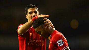 LONDON, ENGLAND - DECEMBER 15: Luis Suarez of Liverpool congratulates Raheem Sterling of Liverpool on scoring their fifth goal during the Barclays Premier League match between Tottenham Hotspur and Liverpool at White Hart Lane on December 15, 2013 in London, England. (Photo by Paul Gilham/Getty Images)