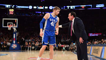 Duke basketball coach Mike Krzyzewski and player Jack White (Photo by Emilee Chinn/Getty Images)