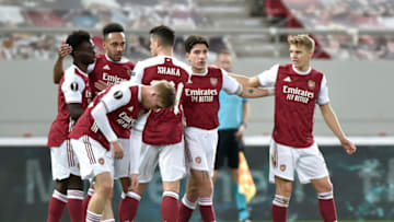 Pierre-Emerick Aubameyang of Arsenal celebrates with teammates Bukayo Saka, Emile Smith Rowe, Granit Xhaka, Hector Bellerin and Martin Odegaard (Photo by Milos Bicanski/Getty Images)