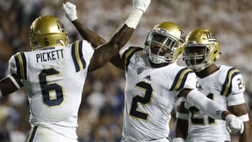Sep 17, 2016; Provo, UT, USA; UCLA Bruins defensive back Adarius Pickett (6) and defensive back Jaleel Wadood (2) celebrate after a hit in the first quarter against the Brigham Young Cougars at Lavell Edwards Stadium. Mandatory Credit: Jeff Swinger-USA TODAY Sports