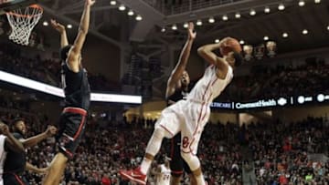 Feb 17, 2016; Lubbock, TX, USA; Oklahoma Sooners guard Isaiah Cousins (11) tries to shoot between Texas Tech Red Raiders guard Toddrick Gotcher (20) and forward Zach Smith (11) in the second half at United Supermarkets Arena. Texas Tech defeated Oklahoma 65-63. Mandatory Credit: Michael C. Johnson-USA TODAY Sports
