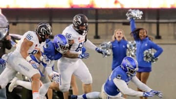 Nov 25, 2016; Colorado Springs, CO, USA; Air Force Falcons linebacker Haji Dunn Jr. (34) dives on a loose ball after a Broncos fumble ahead of Boise State Broncos tight end Chase Blakley (86) and offensive lineman Mario Yakoo (66) in the fourth quarter at Falcon Stadium. Mandatory Credit: Isaiah J. Downing-USA TODAY Sports