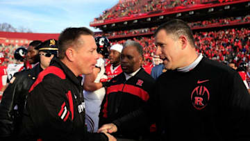 NEW BRUNSWICK, NJ - NOVEMBER 19: Head coach Butch Jones of the Cincinnati Bearcats (L) shakes hands with head coach Greg Schiano of the Rutgers Scarlet Knights after a game at Rutgers Stadium on November 19, 2011 in New Brunswick, New Jersey. (Photo by Patrick McDermott/Getty Images)