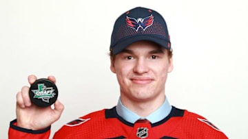 DALLAS, TX - JUNE 22: Alexander Alexeyev poses after being selected thirty-first overall by the Washington Capitals during the first round of the 2018 NHL Draft at American Airlines Center on June 22, 2018 in Dallas, Texas. (Photo by Tom Pennington/Getty Images)