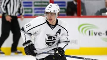 Nov 22, 2015; Raleigh, NC, USA; Los Angeles Kings forward Anze Kopitar (11) watches the play against the Carolina Hurricanes at PNC Arena. The Carolina Hurricanes defeated the Los Angeles Kings 4-3. Mandatory Credit: James Guillory-USA TODAY Sports