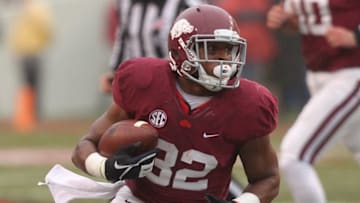 Oct 11, 2014; Fayetteville, AR, USA; Arkansas Razorbacks running back Jonathan Williams (32) runs with the ball during the first quarter against the Alabama Crimson Tide at Donald W. Reynolds Razorback Stadium. Mandatory Credit: Nelson Chenault-USA TODAY Sports