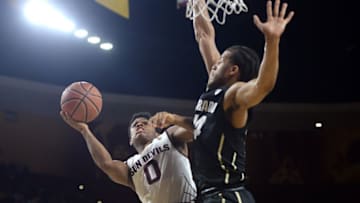 Jan 5, 2017; Tempe, AZ, USA; Arizona State Sun Devils guard Tra Holder (0) attempts a layup over Colorado Buffaloes guard Josh Fortune (44) during the second half at Wells-Fargo Arena. The Sun Devils won 78-77. Mandatory Credit: Joe Camporeale-USA TODAY Sports