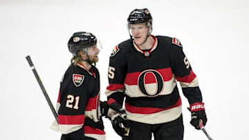 Apr 7, 2016; Ottawa, Ontario, CAN; Ottawa Senators defenseman Michael Kostka (21) and right wing Buddy Robinson (55) following their win against the Florida Panthers at the Canadian Tire Centre. The Senators defeated the Panthers 3-1. Mandatory Credit: Marc DesRosiers-USA TODAY Sports