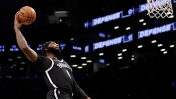 NEW YORK, NEW YORK - FEBRUARY 17: Andre Drummond #4 of the Brooklyn Nets dunks the ball against the Washington Wizards during the first half at Barclays Center on February 17, 2022 in New York City. NOTE TO USER: User expressly acknowledges and agrees that, by downloading and or using this Photograph, user is consenting to the terms and conditions of the Getty Images License Agreement. (Photo by Adam Hunger/Getty Images)