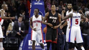 Apr 4, 2015; Auburn Hills, MI, USA; Detroit Pistons guard Reggie Jackson (1), guard Kentavious Caldwell-Pope (5), center Andre Drummond (0), and forward Anthony Tolliver (left) celebrate after the final buzzer against the Miami Heat at The Palace of Auburn Hills. Pistons beat the Heat 99-98. Mandatory Credit: Raj Mehta-USA TODAY Sports