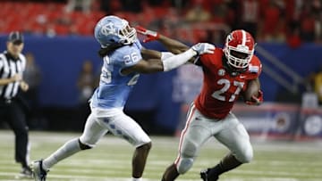 Sep 3, 2016; Atlanta, GA, USA; Georgia Bulldogs running back Nick Chubb (27) runs the ball against North Carolina Tar Heels safety Dominquie Green (26) during the second quarter of the 2016 Chick-Fil-A Kickoff game at Georgia Dome. Mandatory Credit: Brett Davis-USA TODAY Sports