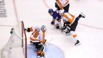 Anders Lee, New York Islanders and Carter Hart, Philadelphia Flyers (Photo by Elsa/Getty Images)