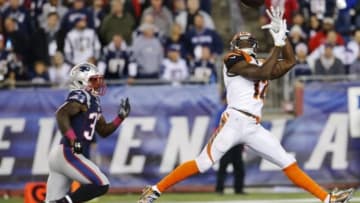 Oct 5, 2014; Foxborough, MA, USA; Cincinnati Bengals wide receiver Mohamed Sanu (12) makes the catch and scores a touchdown against New England Patriots cornerback Alfonzo Dennard (37) during the second half quarter at Gillette Stadium. The Patriots defeated the Bengals 43-17. Mandatory Credit: David Butler II-USA TODAY Sports