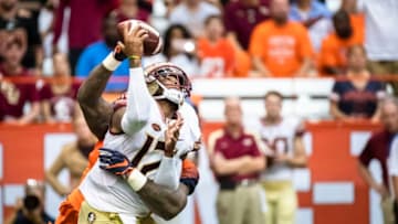 SYRACUSE, NY - SEPTEMBER 15: Chris Slayton #95 of the Syracuse Orange hits Deondre Francois #12 of the Florida State Seminoles as he passes the ball during the first quarter at the Carrier Dome on September 15, 2018 in Syracuse, New York. (Photo by Brett Carlsen/Getty Images)