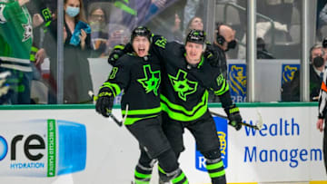 Feb 11, 2022; Dallas, Texas, USA; Dallas Stars left wing Jason Robertson (21) and center Roope Hintz (24) celebrate Robertson scoring the game winning goal against the Winnipeg Jets during the overtime period at the American Airlines Center. Mandatory Credit: Jerome Miron-USA TODAY Sports
