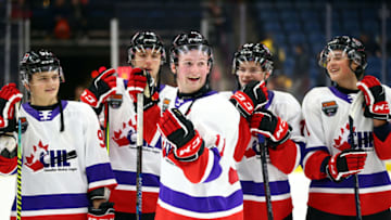 Alexis Lafreniere #11 of Team White laughs with teammates following the final whistle of the 2020 CHL/NHL Top Prospects Game against Team Red. (Photo by Vaughn Ridley/Getty Images)