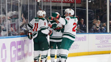 NEW YORK, NY - NOVEMBER 25: Zach Parise #11 of the Minnesota Wild celebrates with teammates after scoring a goal in the second period against the New York Rangers at Madison Square Garden on November 25, 2019 in New York City. (Photo by Jared Silber/NHLI via Getty Images)