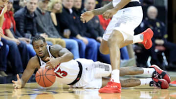 LOUISVILLE, KENTUCKY - JANUARY 24: V.J. King #13 of the Louisville Cardinals reaches for a loose ball during the 84-77 win over the North Carolina State Wolfpack at KFC YUM! Center on January 24, 2019 in Louisville, Kentucky. (Photo by Andy Lyons/Getty Images)