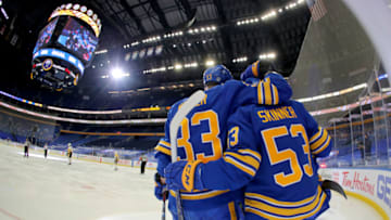 Apr 18, 2021; Buffalo, New York, USA; Buffalo Sabres defenseman Colin Miller (33) and left wing Jeff Skinner (53) celebrate after a goal by center Sam Reinhart (not pictured) against the Pittsburgh Penguins during the second period at KeyBank Center. Mandatory Credit: Timothy T. Ludwig-USA TODAY Sports