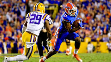 Oct 17, 2015; Baton Rouge, LA, USA; Florida Gators wide receiver Demarcus Robinson (11) runs past LSU Tigers safety Rickey Jefferson (29) during the second half of a game at Tiger Stadium. LSU defeated Florida 35-28.Mandatory Credit: Derick E. Hingle-USA TODAY Sports