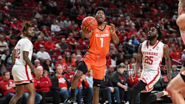 Jan 10, 2023; Lincoln, Nebraska, USA; Illinois Fighting Illini guard Sencire Harris (1) scores against Nebraska Cornhuskers guard Emmanuel Bandoumel (25) in the second half at Pinnacle Bank Arena. Mandatory Credit: Steven Branscombe-USA TODAY Sports