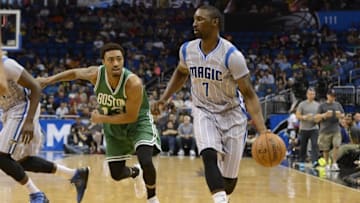 Mar 8, 2015; Orlando, FL, USA; Orlando Magic guard Ben Gordon (7) dribbles as Boston Celtics guard James Young (13) defends during the second quarter at Amway Center. Mandatory Credit: Tommy Gilligan-USA TODAY Sports