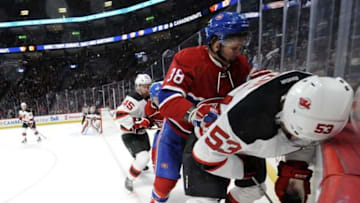 Sep 26, 2016; Montreal, Quebec, CAN; Montreal Canadiens forward Nikita Scherbak (38) checks New Jersey Devils defenseman Vojtech Mozik (53) into the boards during the first period of a preseason hockey game at the Bell Centre. Mandatory Credit: Eric Bolte-USA TODAY Sports