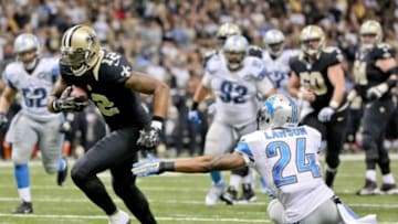 Dec 21, 2015; New Orleans, LA, USA; New Orleans Saints wide receiver Marques Colston (12) scores a touchdown past Detroit Lions cornerback Nevin Lawson (24) during the second half of a game at the Mercedes-Benz Superdome. The Lions defeated the Saints 35-27. Mandatory Credit: Derick E. Hingle-USA TODAY Sports