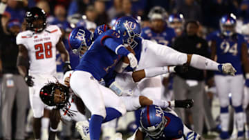 Quarterback Jett Duffey #7 of the Texas Tech Red Raiders carries the ball as Gavin Potter #19 of Kansas football defends during the game. (Photo by Jamie Squire/Getty Images)