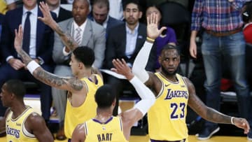 LOS ANGELES, CA - OCTOBER 2: LeBron James #23 of the Los Angeles Lakers exchanges a high five with teammate Josh Hart #3 against the Denver Nuggets during a pre-season game on October 2, 2018 at STAPLES Center in Los Angeles, California. NOTE TO USER: User expressly acknowledges and agrees that, by downloading and/or using this Photograph, user is consenting to the terms and conditions of the Getty Images License Agreement. Mandatory Copyright Notice: Copyright 2018 NBAE (Photo by Chris Elise/NBAE via Getty Images)