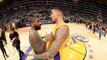 LOS ANGELES, CA - JANUARY 23: Kyrie Irving #11 of the Boston Celtics and Kyle Kuzma #0 of the Los Angeles Lakers exchange a hug after the game between the two teams on January 23, 2018 at STAPLES Center in Los Angeles, California. NOTE TO USER: User expressly acknowledges and agrees that, by downloading and/or using this Photograph, user is consenting to the terms and conditions of the Getty Images License Agreement. Mandatory Copyright Notice: Copyright 2018 NBAE (Photo by Andrew D. Bernstein/NBAE via Getty Images)
