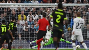 Tottenham Hotspur's French goalkeeper Hugo Lloris (R) dives but fails to save the ball conceding the opening goal to Sporting Lisbon's English striker Marcus Edwards (L) during the UEFA Champions League group D football match between Tottenham Hotspur and Sporting Lisbon at the Tottenham Hotspur Stadium in London, on October 26, 2022. (Photo by Ben Stansall / AFP) (Photo by BEN STANSALL/AFP via Getty Images)