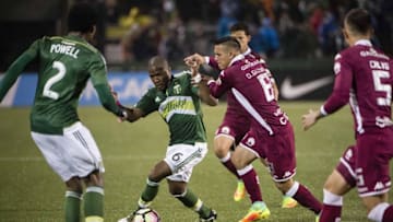 Oct 19, 2016; Portland, OR, USA; Portland Timbers forward Darlington Nagbe (6) is guarded by Deportivo Saprissa defender David Guzman (8) during the second half at Providence Park. The game ended tied 1-1. Mandatory Credit: Troy Wayrynen-USA TODAY Sports
