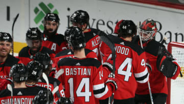 NEWARK, NEW JERSEY - JANUARY 24: The New Jersey Devils celebrate a 2-0 shutout against the New York Islanders at the Prudential Center on January 24, 2021 in Newark, New Jersey. (Photo by Bruce Bennett/Getty Images)