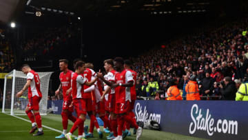 Arsenal's Brazilian striker Gabriel Martinelli (L) celebrates after scoring his team third goal during the English Premier League football match between Watford and Arsenal at Vicarage Road Stadium in Watford, north-west of London on March 6, 2022. - RESTRICTED TO EDITORIAL USE. No use with unauthorized audio, video, data, fixture lists, club/league logos or 'live' services. Online in-match use limited to 120 images. An additional 40 images may be used in extra time. No video emulation. Social media in-match use limited to 120 images. An additional 40 images may be used in extra time. No use in betting publications, games or single club/league/player publications. (Photo by Adrian DENNIS / AFP) / RESTRICTED TO EDITORIAL USE. No use with unauthorized audio, video, data, fixture lists, club/league logos or 'live' services. Online in-match use limited to 120 images. An additional 40 images may be used in extra time. No video emulation. Social media in-match use limited to 120 images. An additional 40 images may be used in extra time. No use in betting publications, games or single club/league/player publications. / RESTRICTED TO EDITORIAL USE. No use with unauthorized audio, video, data, fixture lists, club/league logos or 'live' services. Online in-match use limited to 120 images. An additional 40 images may be used in extra time. No video emulation. Social media in-match use limited to 120 images. An additional 40 images may be used in extra time. No use in betting publications, games or single club/league/player publications. (Photo by ADRIAN DENNIS/AFP via Getty Images)