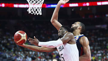 DONGGUAN, CHINA - SEPTEMBER 11: Donovan Mitchell #5 of USA goes to the basket against Rudy Gobert #27 of France during FIBA World Cup 2019 quarter-final match between the United States and France at Dongguan Basketball Center on September 11, 2019 in Dongguan, Guangdong Province of China. (Photo by VCG/VCG via Getty Images)